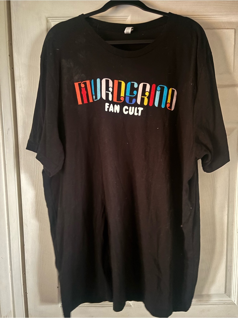Black Short-Sleeve Tee w/Multicolor Fan Cult Logo. My favorite murder.